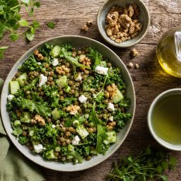 Green Mediterranean meal with lentil salad, leafy greens, walnuts, olive oil and green tea