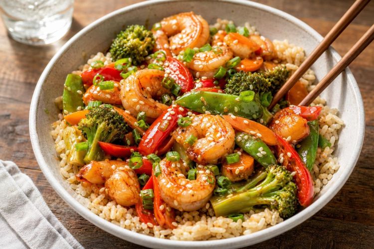 Shrimp and vegetable stir-fry served over brown rice