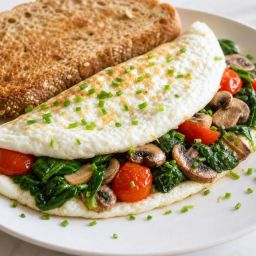 Egg-white omelet filled with spinach, mushrooms and tomatoes