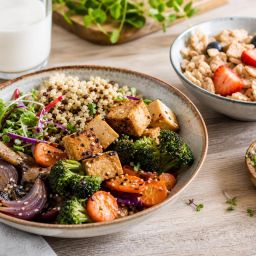 Vegan grain bowl with tofu and vegetables, plant-based milk and fortified cereal